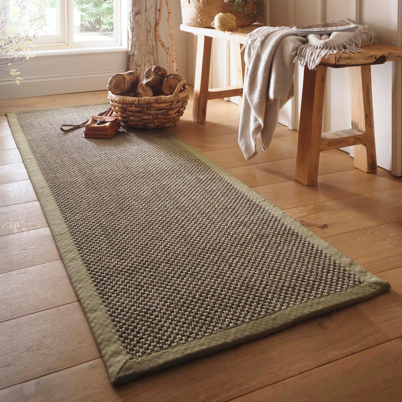 Sisal Green with Sage Green Border Runner with a green border and a green textured centre, styled in front of a window.