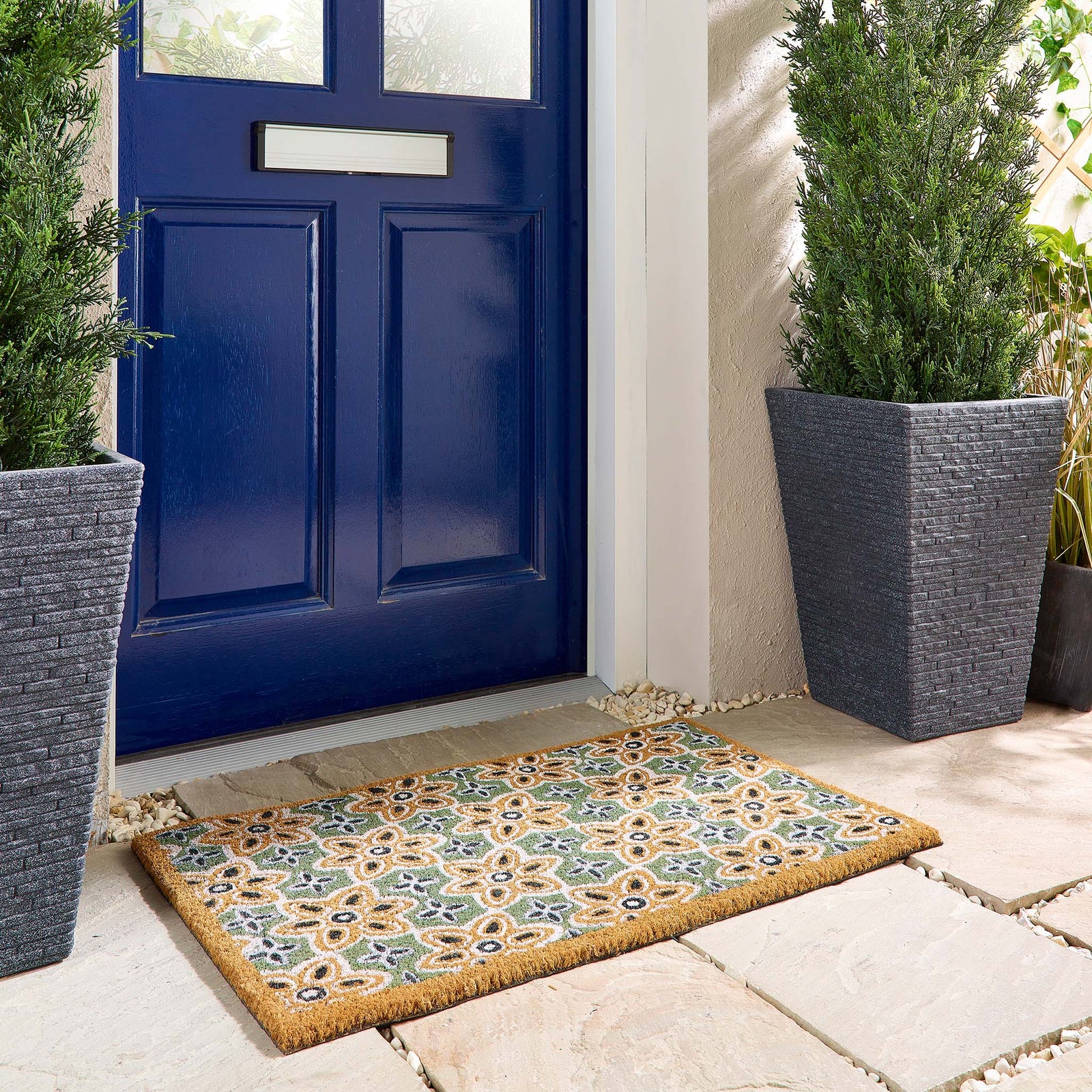 Sage Green Woodblock Coir Doormat made from natural coconut fibres, featuring a colourful woodblock pattern.
