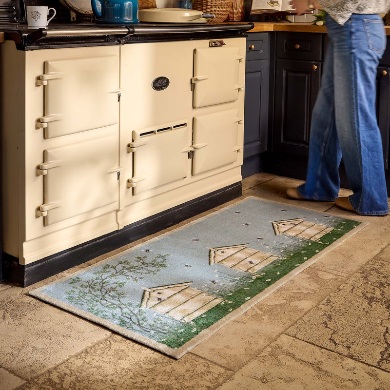 Aura Beehive Washable Blue Runner with a nature-inspired design, styled in a doorway.