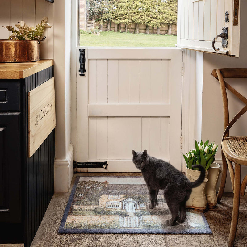 Country Cottage Washable Doormat- made from eco-friendly material featuring a countryside cottage design.