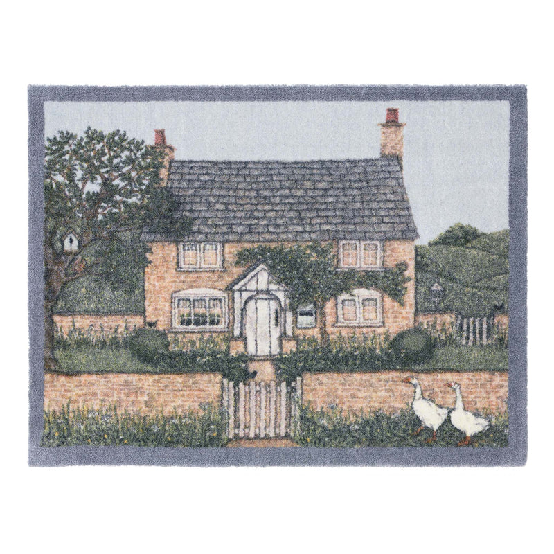 Country Cottage Washable Doormat- made from eco-friendly material featuring a countryside cottage design.