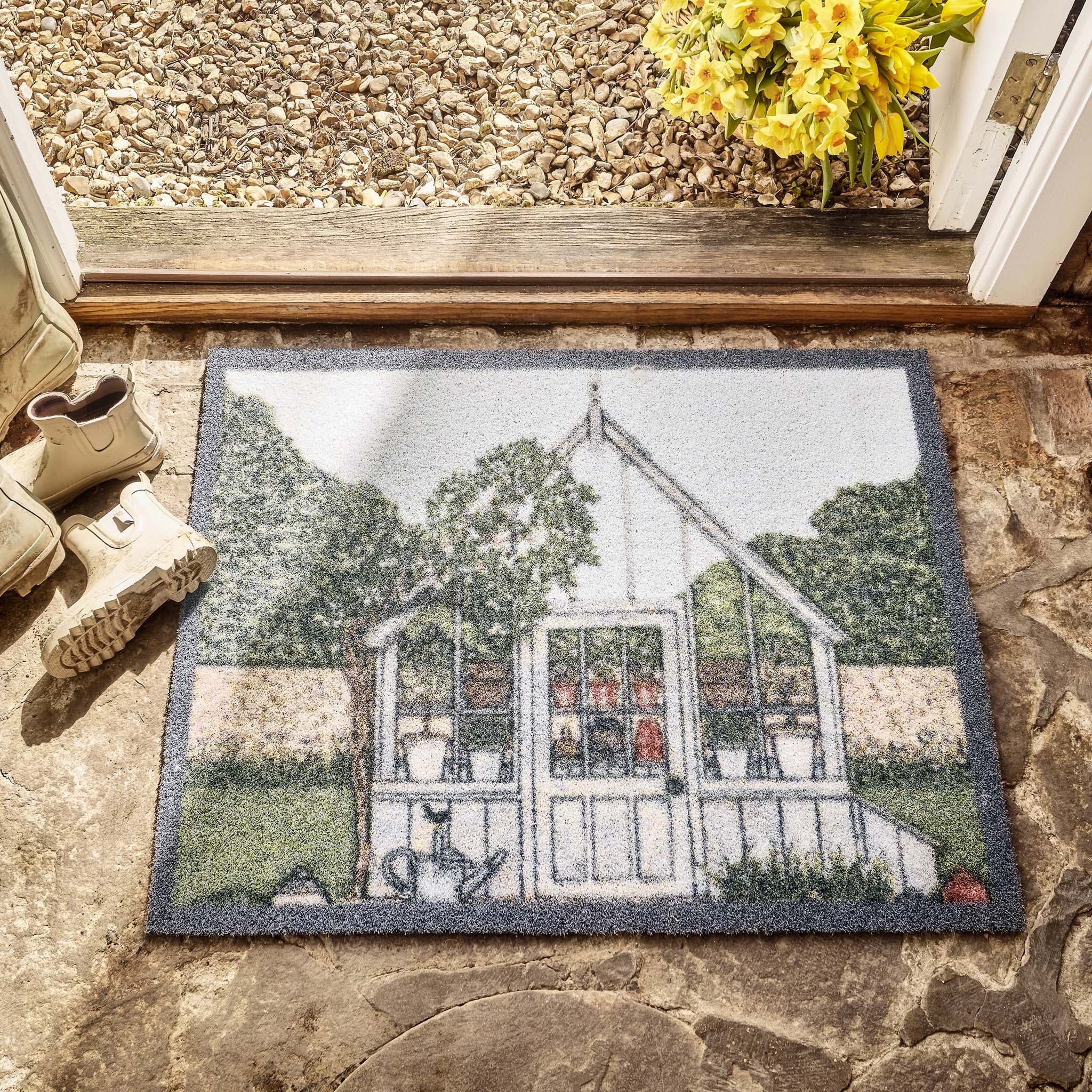 Green House Outdoor Doormat- made from recycled materials featuring a greenhouse. 