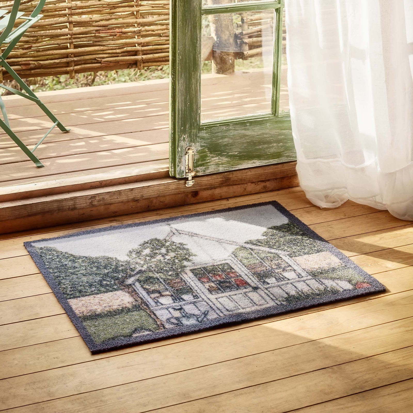 Green House Outdoor Doormat- made from recycled materials featuring a greenhouse. 