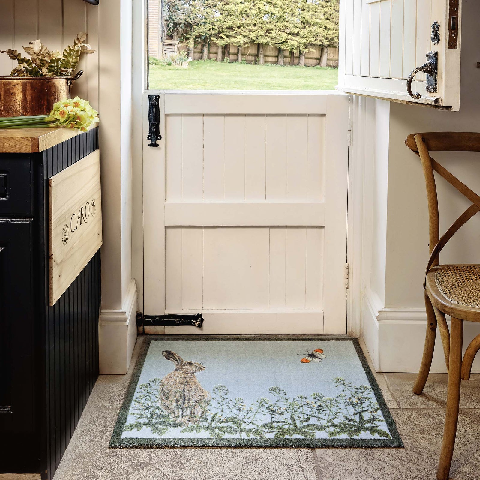 Hare & Shepard's Purse Washable Doormat- made from eco-friendly materials featuring a hare chasing a butterfly. 