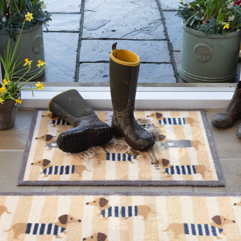 Hug Rug Beige Sausage Chic Washable Doormat made from 100% recycled cotton, featuring sausage dogs in jumpers.