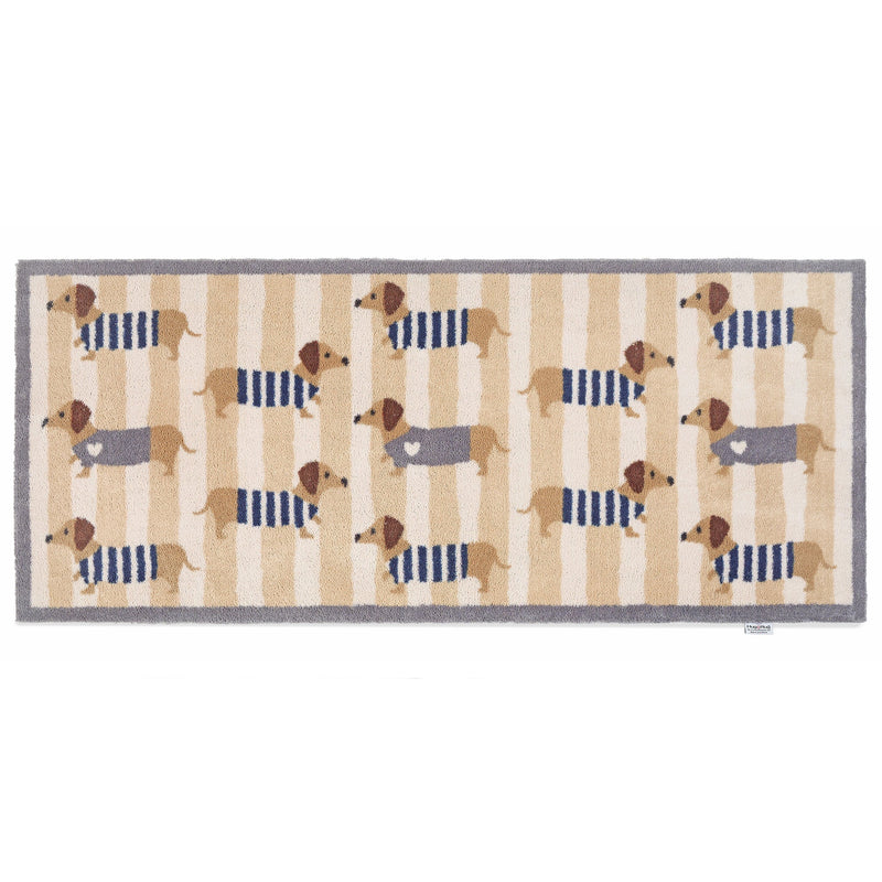 Sausage Dog Chic Washable Runner- 100% recycled cotton runner featuring sausage dogs in jumpers against a beige and cream striped background. 