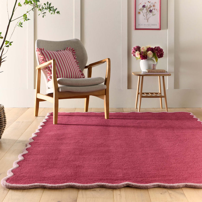 Scalloped Elise Coral Rug - 100% wool rug in dark pink with a lighter pink scalloped border. 
