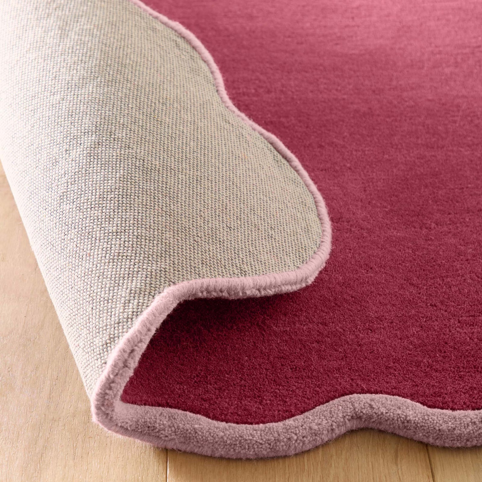 Scalloped Elise Coral Runner - 100% wool runner in dark pink with a lighter pink scalloped border. 