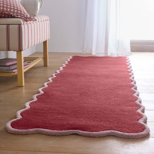 Scalloped Elise Coral/Lilac Runner Rug- 100% wool runner in a dark pink featuring a wavy border.