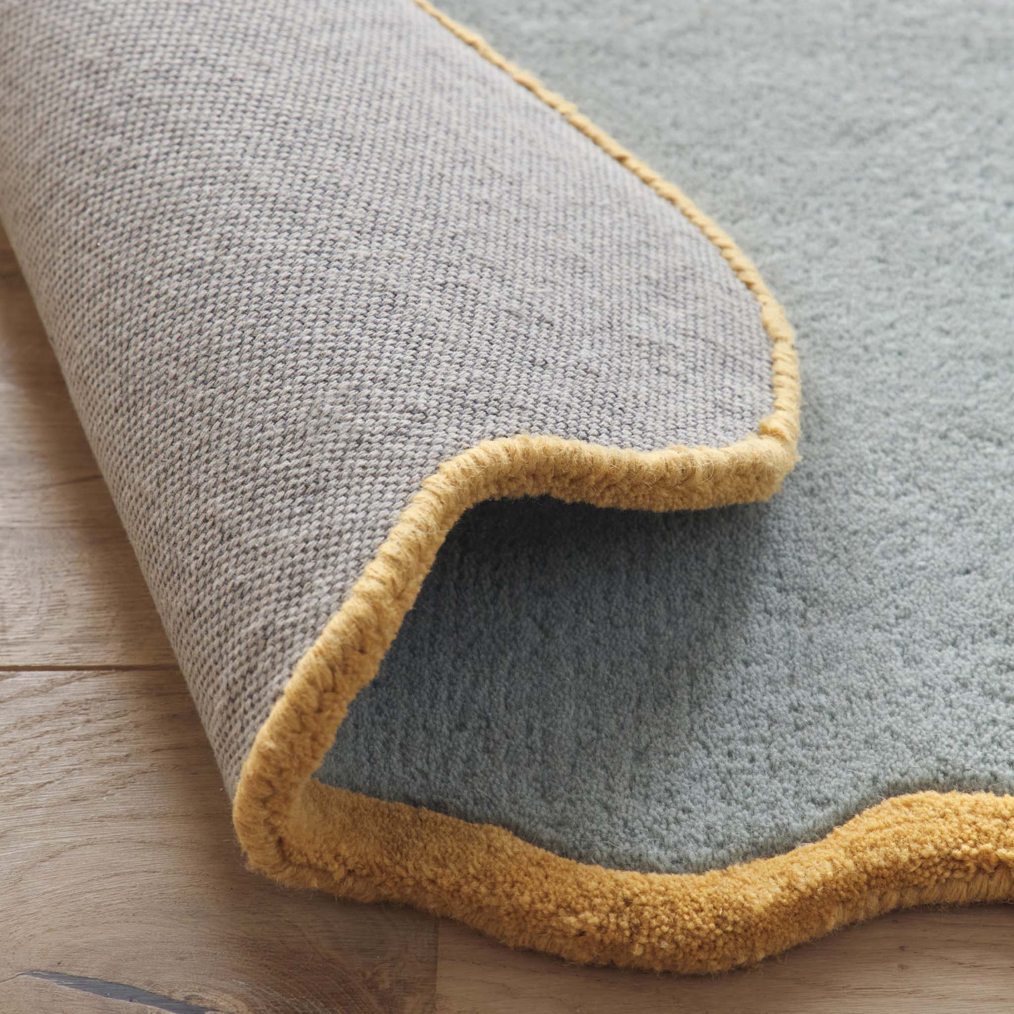Scalloped Elise Duck Egg Rug Runner- 100% wool runner in duck egg featuring a wavy border.