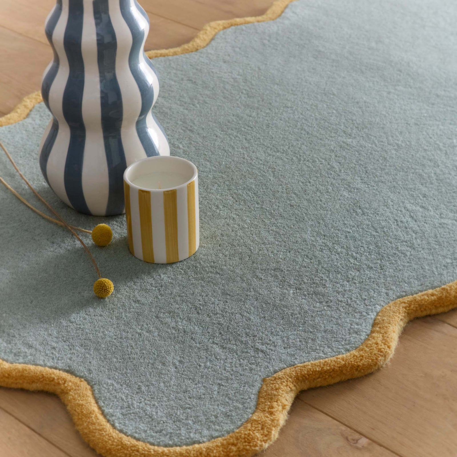 Scalloped Elise Duck Egg Ochre Runner - a 100% wool blue runner featuring a scalloped yellow border. 