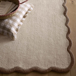 Scalloped Elsie Rug Natural/Brown- 100% wool rug with a natural brown wavy border.