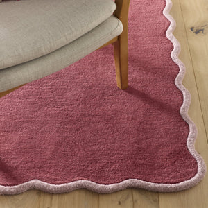 Scalloped Elise- 100% wool cut & loop pile rug in Coral and Lilac with a thick border. 