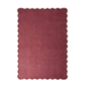 Scalloped Elise- 100% wool cut & loop pile rug in Coral and Lilac with a thick border. 