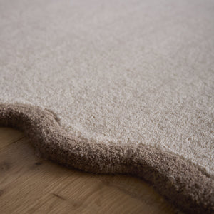 Scalloped Elise Rug in Natural and Brown- a 100% wool cut, loop pile rug with a wavy  border. 