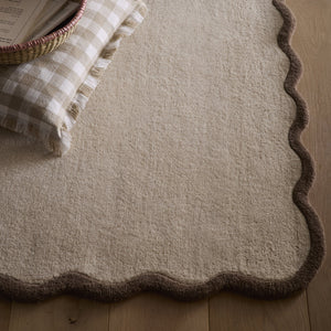 Scalloped Elise Rug in Natural and Brown- a 100% wool cut, loop pile rug with a wavy  border. 