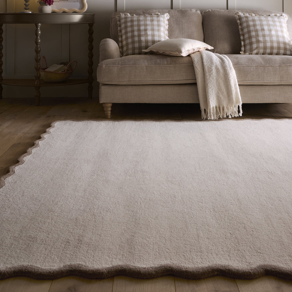 Scalloped Elise Rug in Natural and Brown- a 100% wool cut, loop pile rug with a wavy  border. 