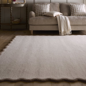 Scalloped Elise Rug in Natural and Brown- a 100% wool cut, loop pile rug with a wavy  border. 