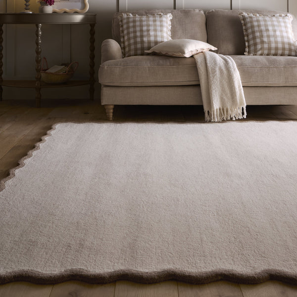 Scalloped Elise Rug in Natural and Brown- a 100% wool cut, loop pile rug with a wavy  border. 