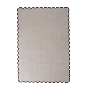 Scalloped Elise Rug in Natural and Brown- a 100% wool cut, loop pile rug with a wavy  border. 