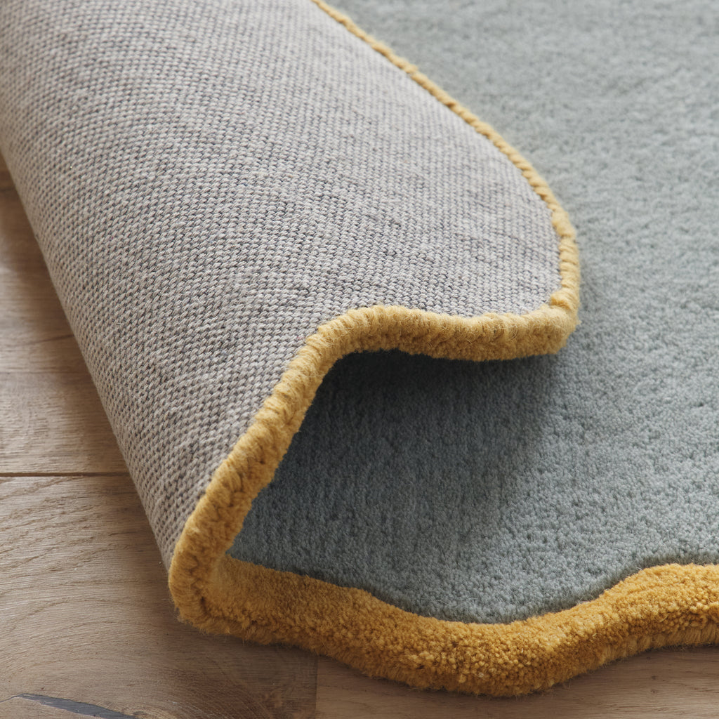 Scalloped Elsie Rug- a 100% hand-tufted rug in Duck Egg with wavy border. 