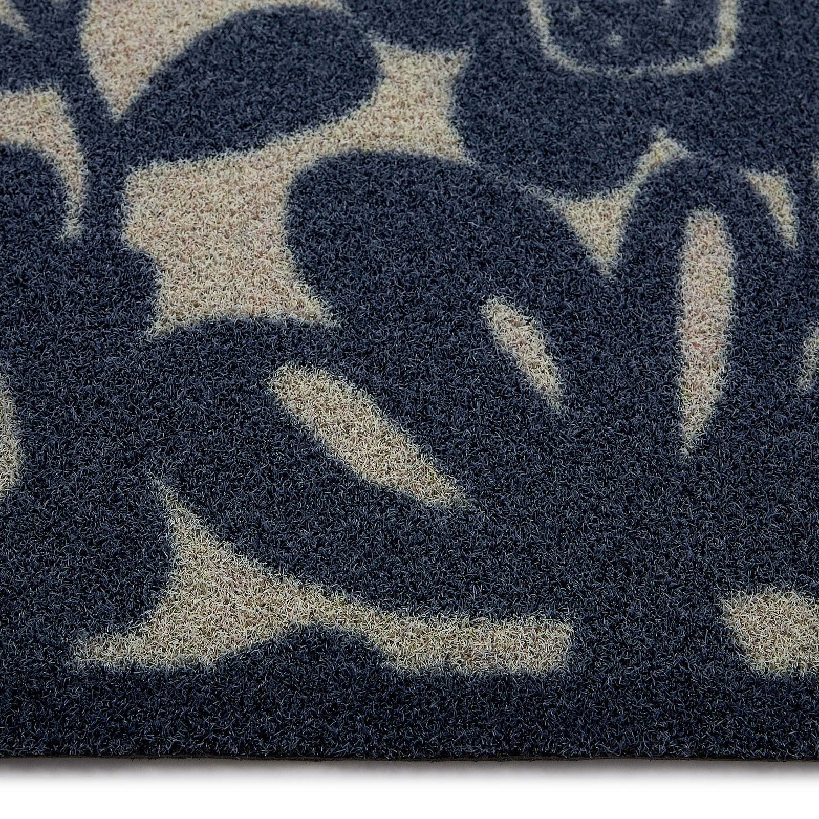 Kukkia Dark Navy Outdoor Doormat with a floral design, styled with pile height showing.