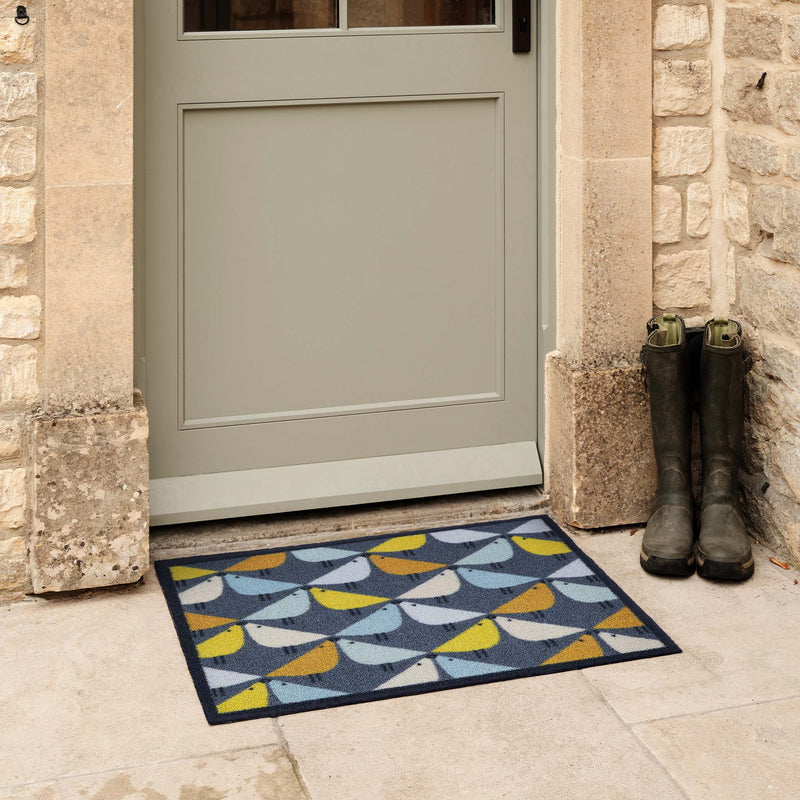 Lintu Blue Outdoor Doormat. Made from ECONYL rengerated yarn featuring lintu birds.