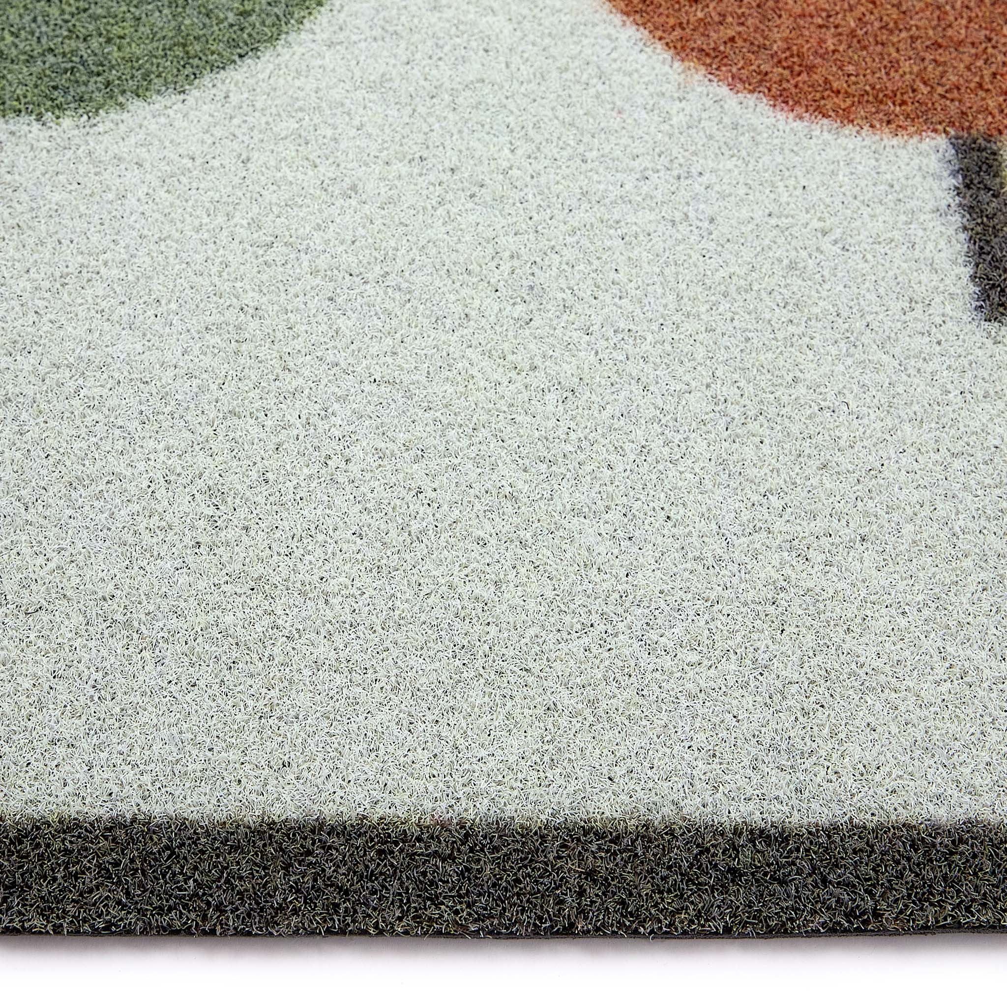 Scion Lintu Rust Green Outdoor Doormat with a lintu bird design, styled with pile height showing.