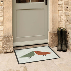Lintu Rust/Green Outdoor Doormat. Made from Econyl regenerated yarn featuring two Lintu Birds.