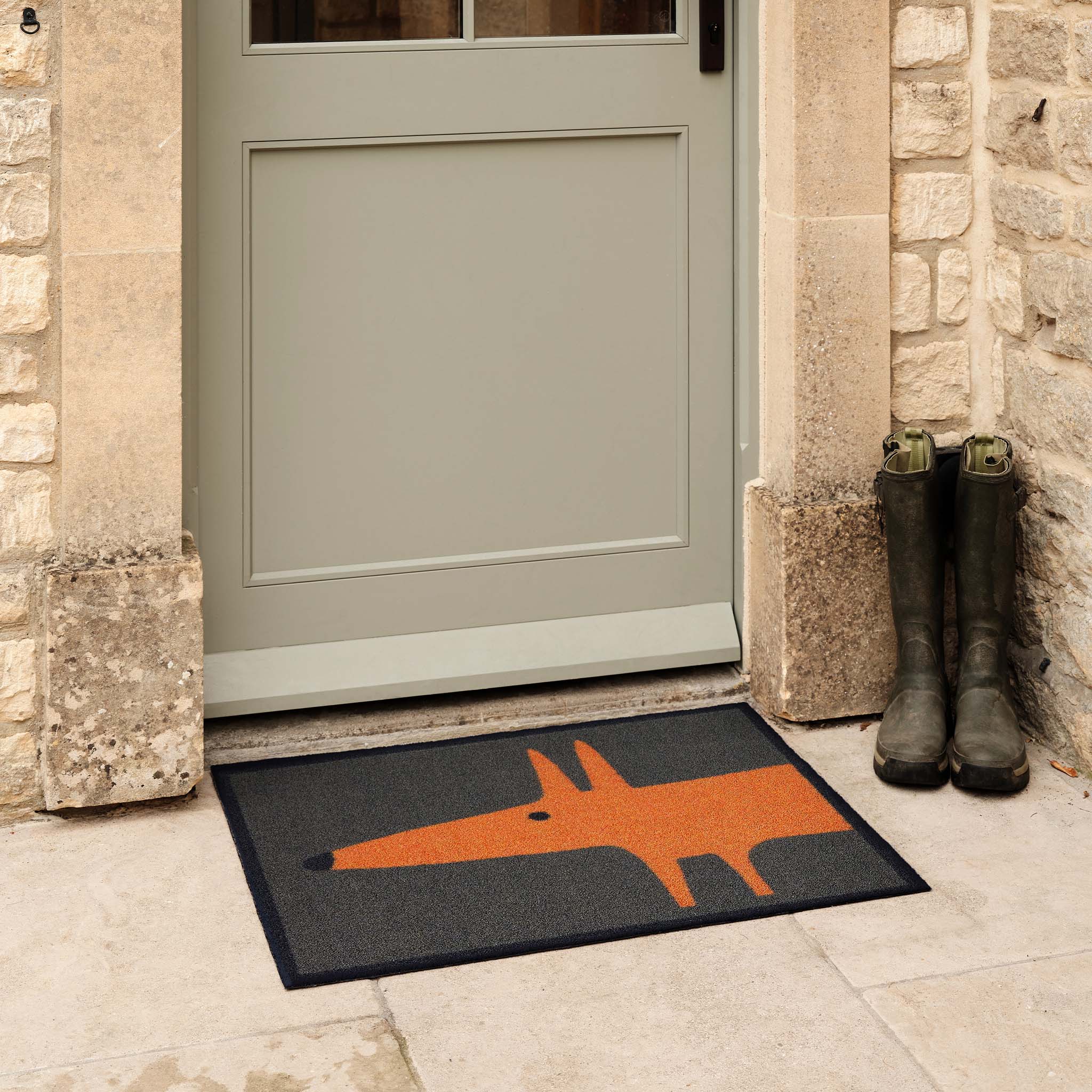 Mr Fox Orange Outdoor Doormat. Made from ECONYL regenerated yarn featuring an orange fox.