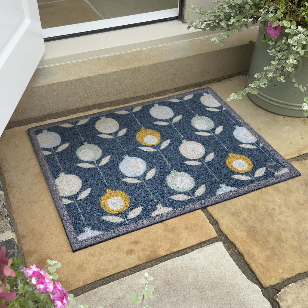 Pepino Blue Outdoor Doormat. Made from ECONYL regenerated yearn featurning a floral design.