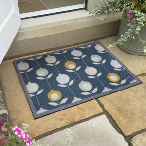 Pepino Blue Outdoor Doormat. Made from ECONYL regenerated yearn featurning a floral design.