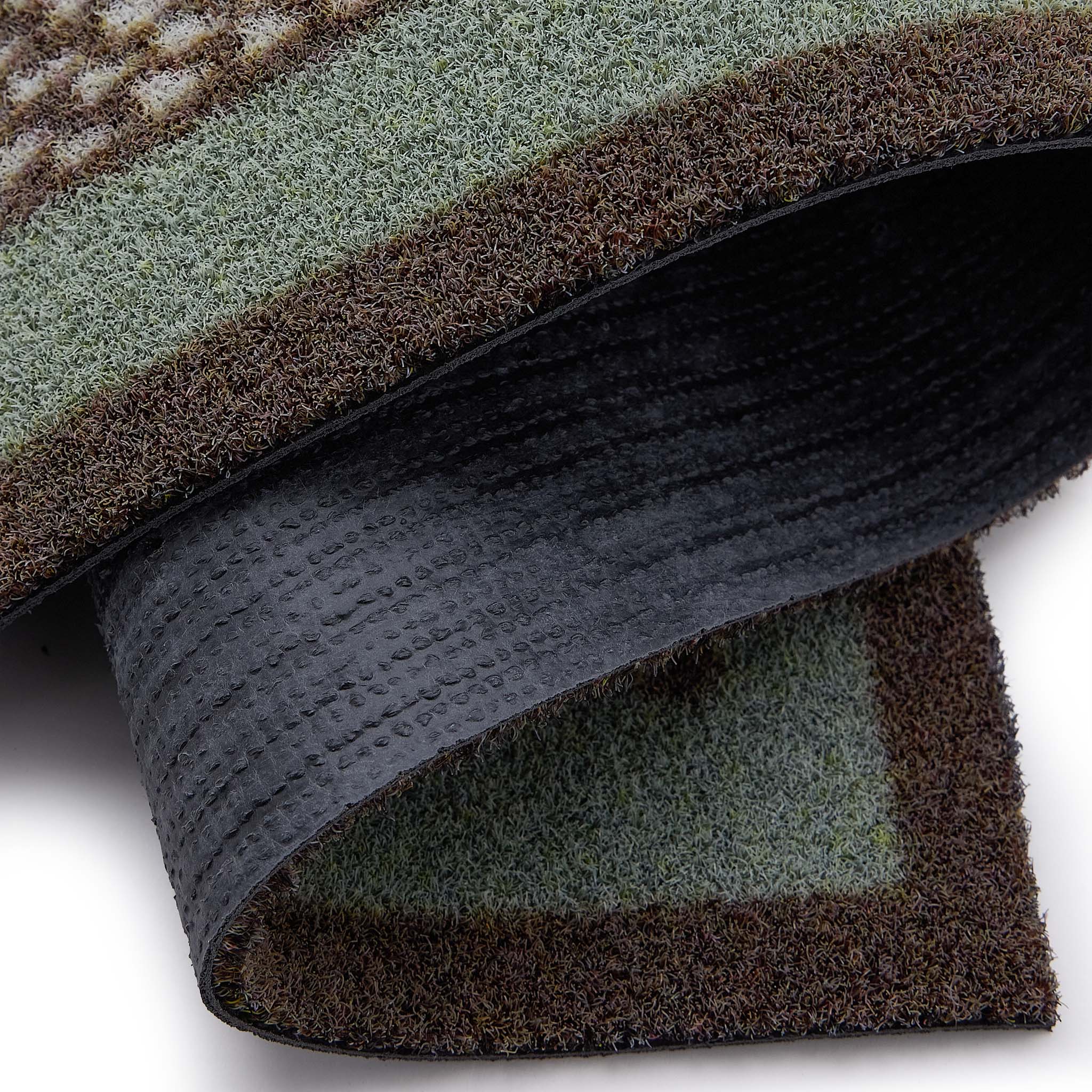 Scion Spike Green Outdoor Doormat with hedgehog design, styled with backing showing.