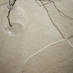 Sculptured Wool Boulder Rug- a 100% wool cut pile rug in Cream with a patterned design. 