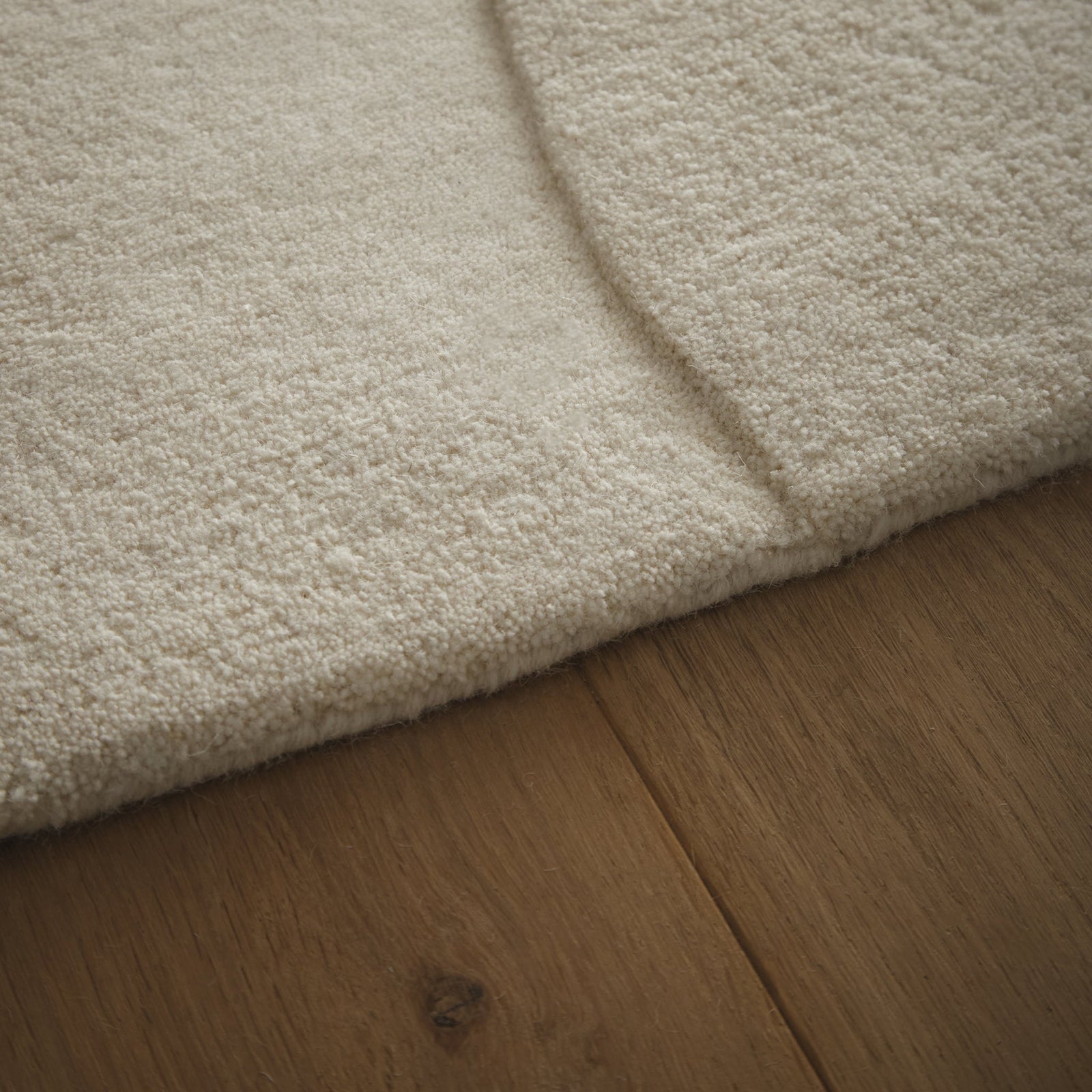 Sculptured Wool Boulder Rug- a 100% wool cut pile rug in Cream with a patterned design. 