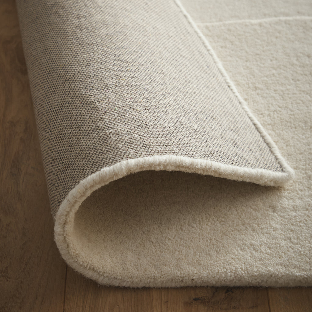 Sculptured Wool Boulder Rug- a 100% wool cut pile rug in Cream with a patterned design. 