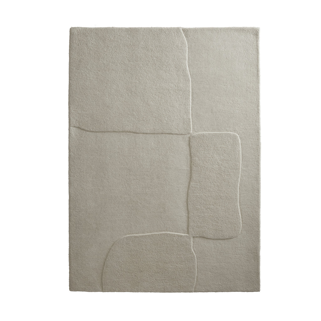 Sculptured Wool Boulder Rug- a 100% wool cut pile rug in Cream with a patterned design. 