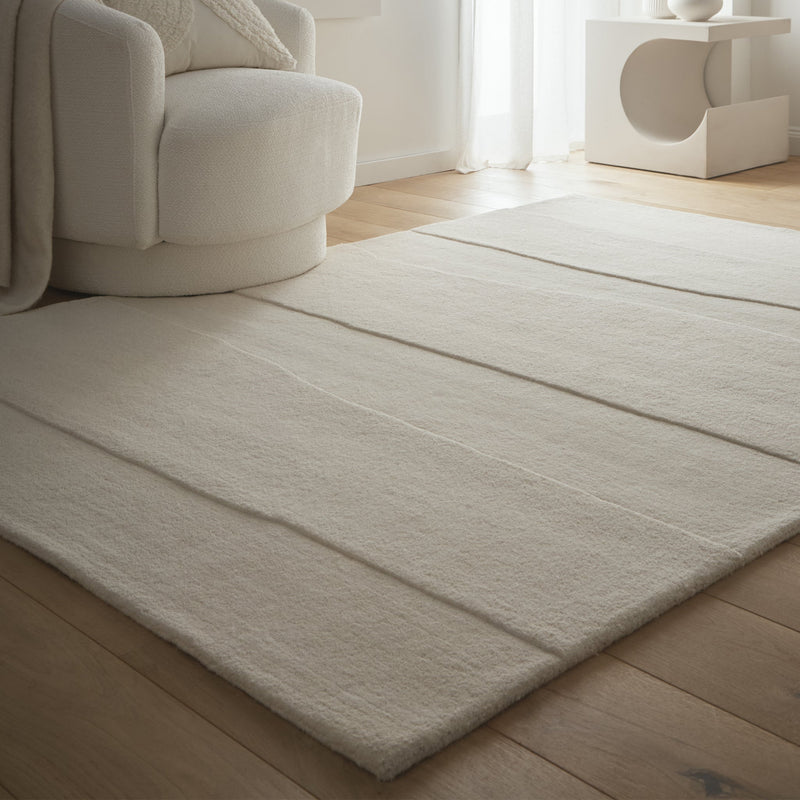 Sculptured Rug- 100% wool cut pile rug in Cream with a sculptured pattern. 