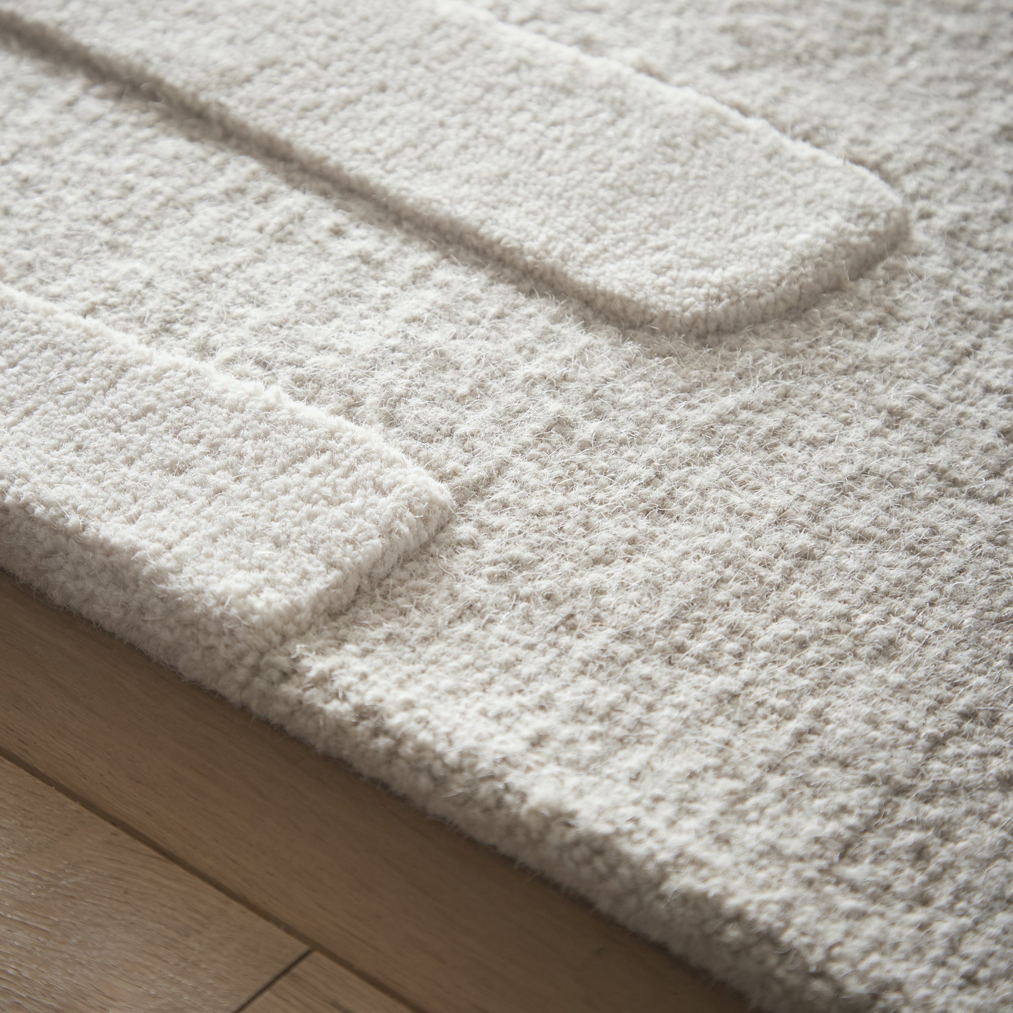 Sculptured Wool Stone Rug in Cream. 100% wool cut & loop pile rug in Cream with a patterned design. 