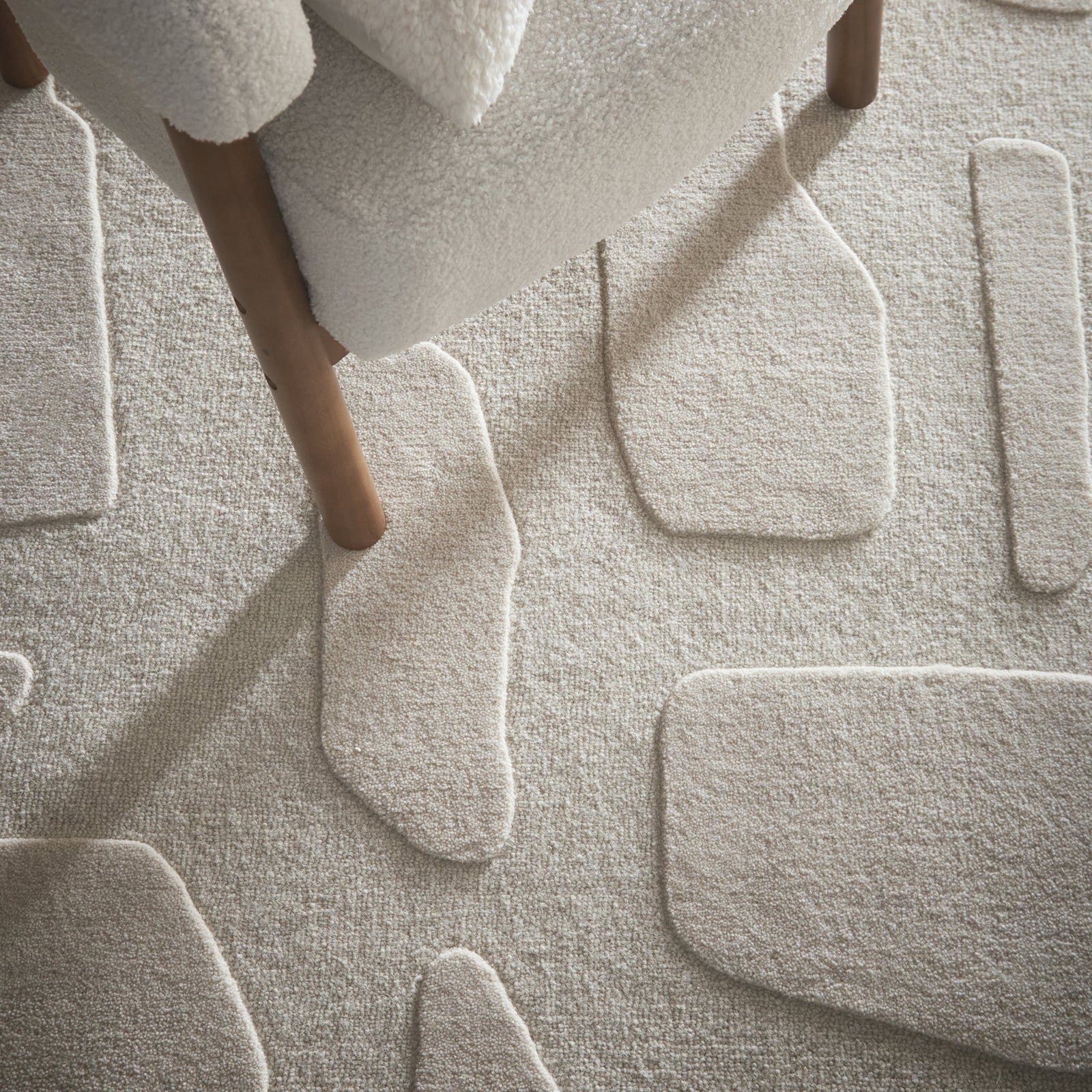 Sculptured Wool Stone Rug in Cream. 100% wool cut & loop pile rug in Cream with a patterned design. 