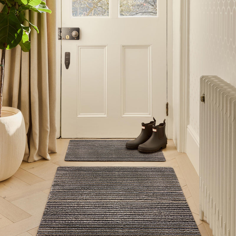 Select New England Stripe Doormat made from 100% recycled materials, featuring a subtle striped pattern. 