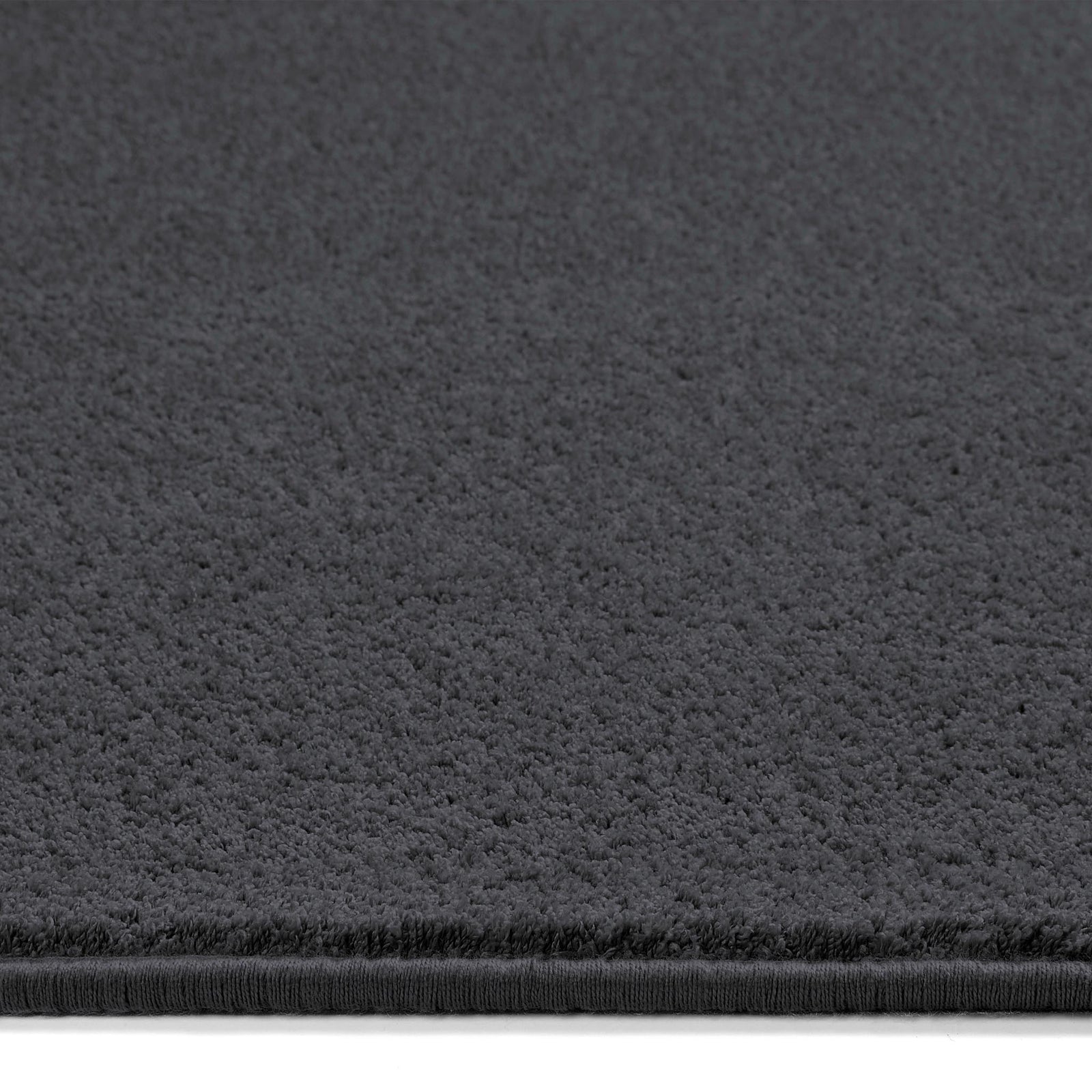 Sense Charcoal Washable Rug Runner- a 100% recycled polyester rug runner in a dark grey.
