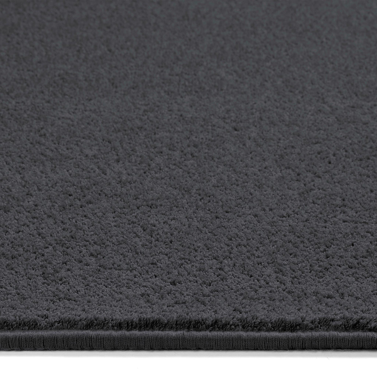 Sense Charcoal Washable Rug Runner- a 100% recycled polyester rug runner in a dark grey.