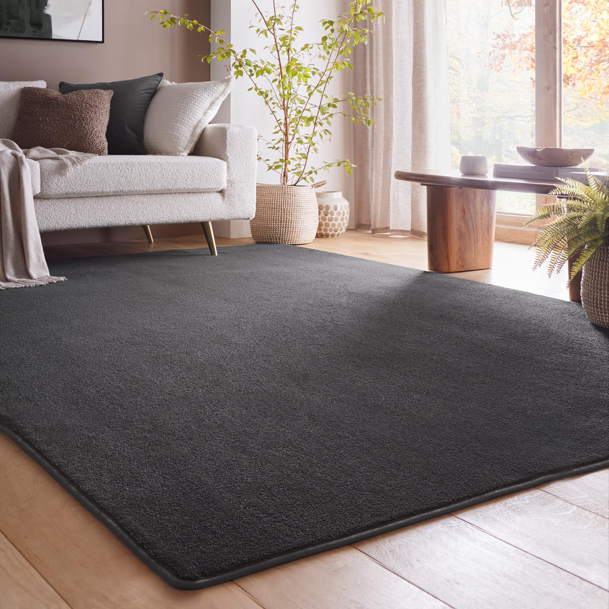Sense Charcoal Washable Rug- a 100% recycled polyester rug in a dark grey.