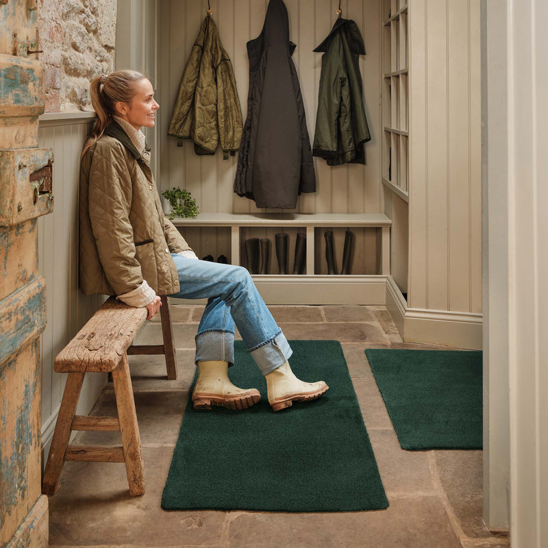 Sense Forest Green Runner and Doormat, styled in a boot room. 