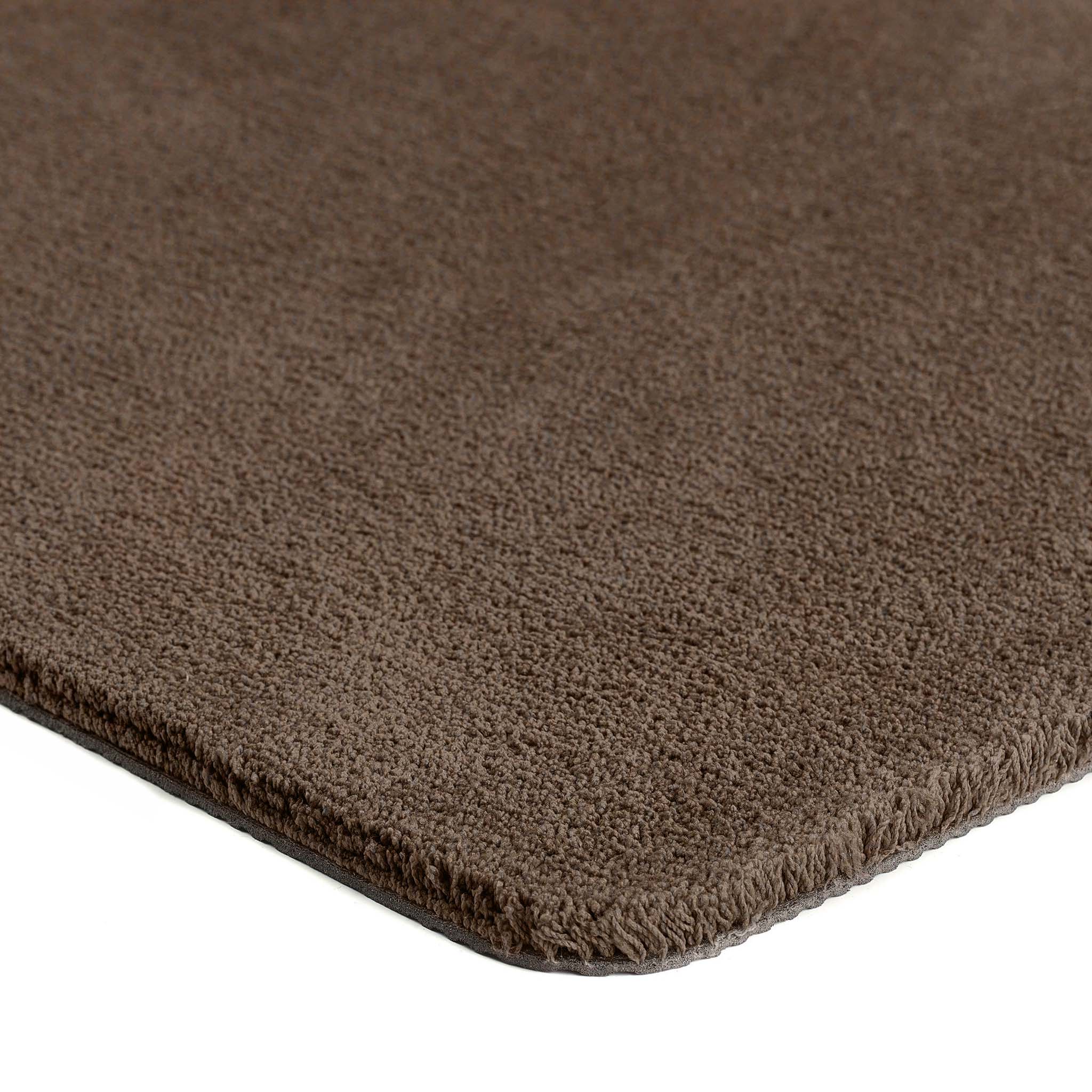 Sense Stone Washable Doormat in brown made from recycled materials, styled with pile height showing.