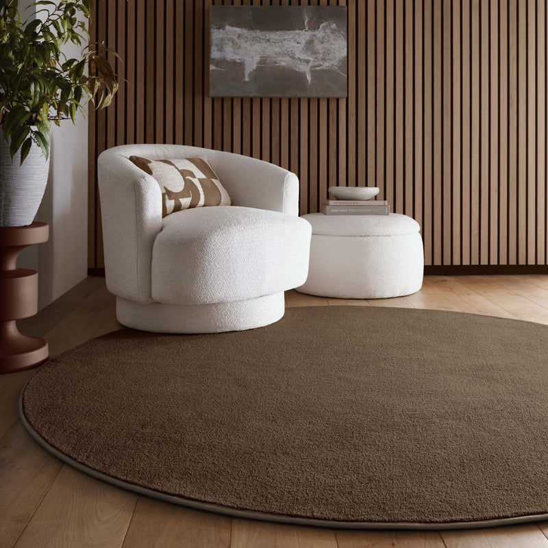 Sense Stone Washable Rug in Brown made from recycled materials, styled in a living room.
