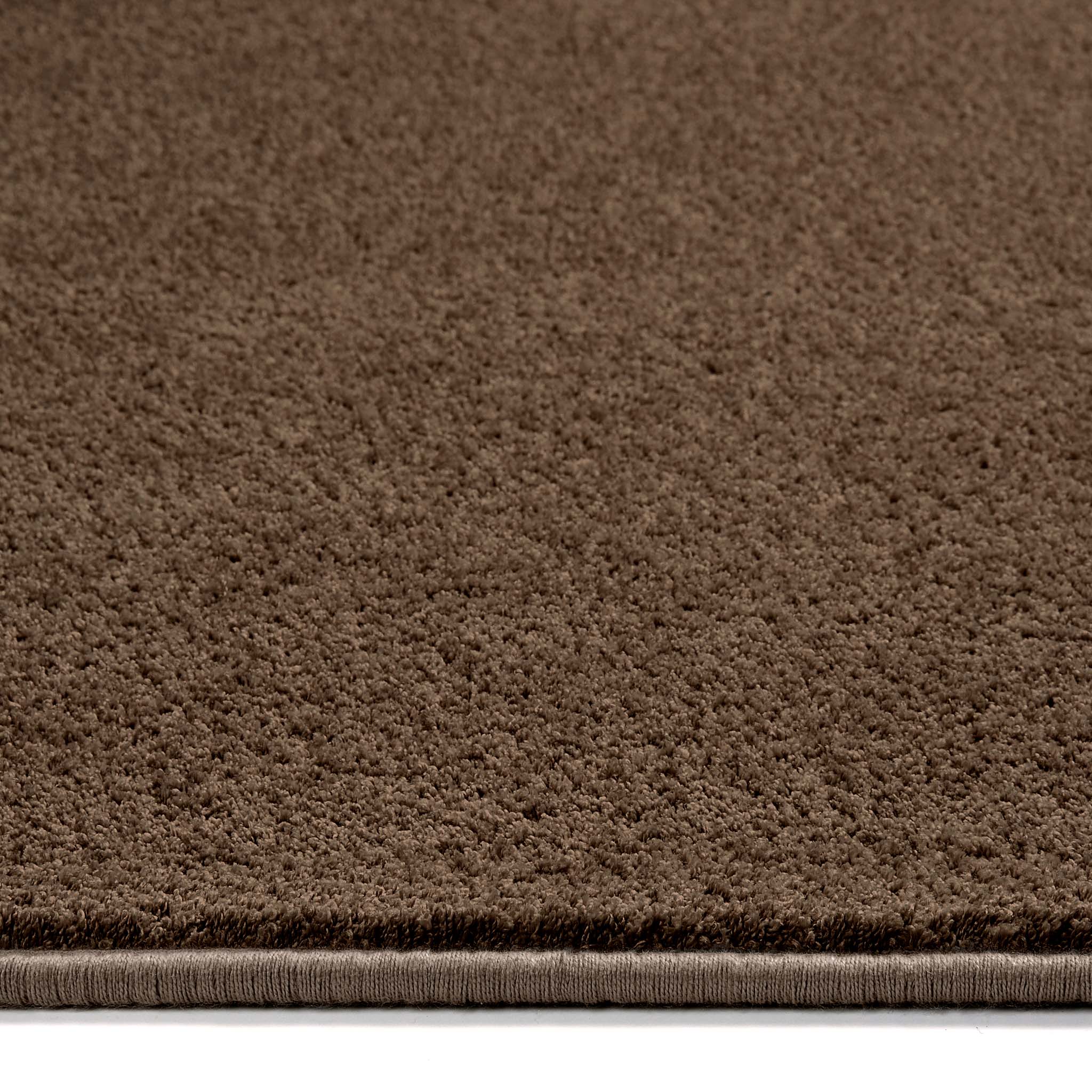 Sense Stone Washable Rug in Brown, styled with pile height showing.
