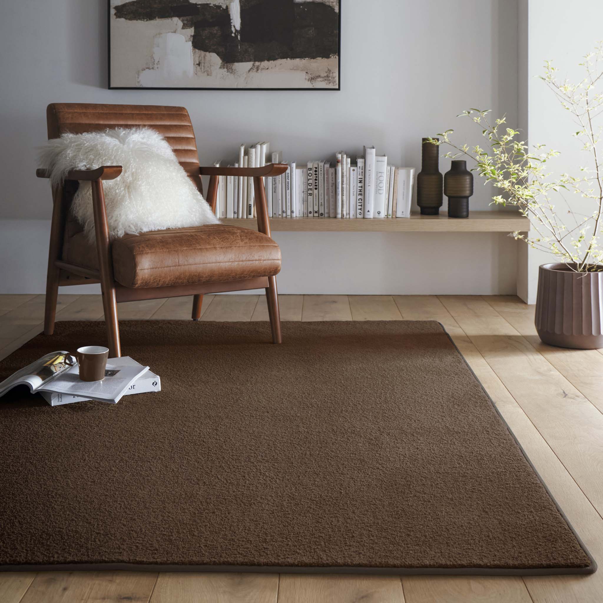 Sense Stone Washable Rug in Brown, styled in a living room. 