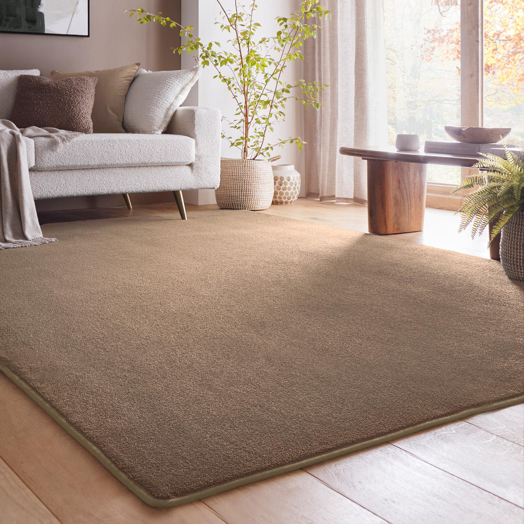 Sense Stone Rug- a rug in a solid beige made up from 100% plastic bottles.